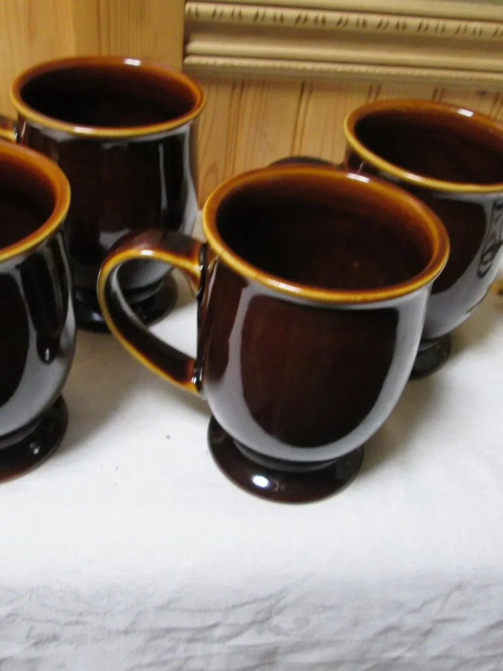 4 vtg Earthenware coffee mugs drip brown glaze pedestal